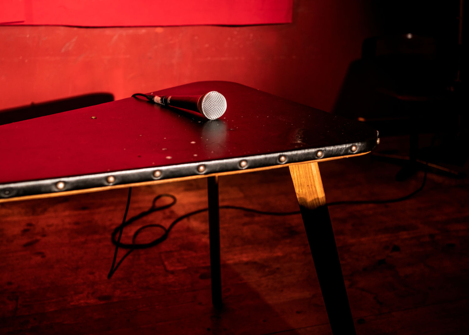 Stand-up still life: mic without stand on small table